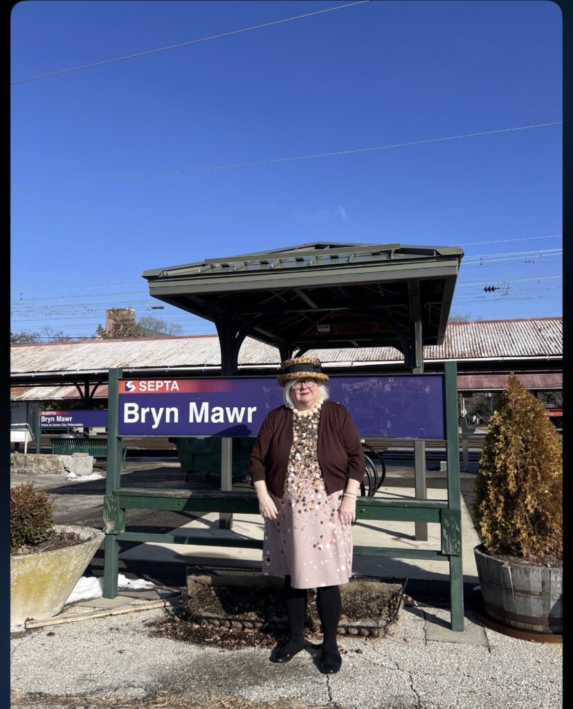 Michelle Leonard, Main Line REALTOR® and “The Hat Lady,” at a Bryn Mawr train station